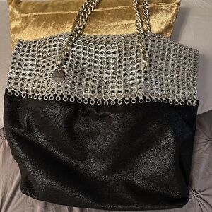 Elegant Black and Silver Hobo supreme shoulder with chain straps.